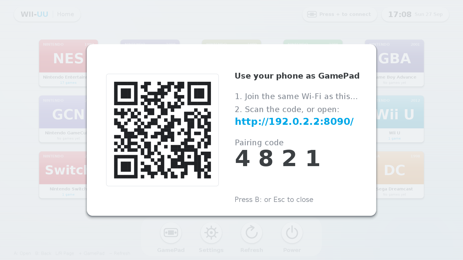 The pairing card on the TV showing a QR code, the GamePad URL and a 4-digit code